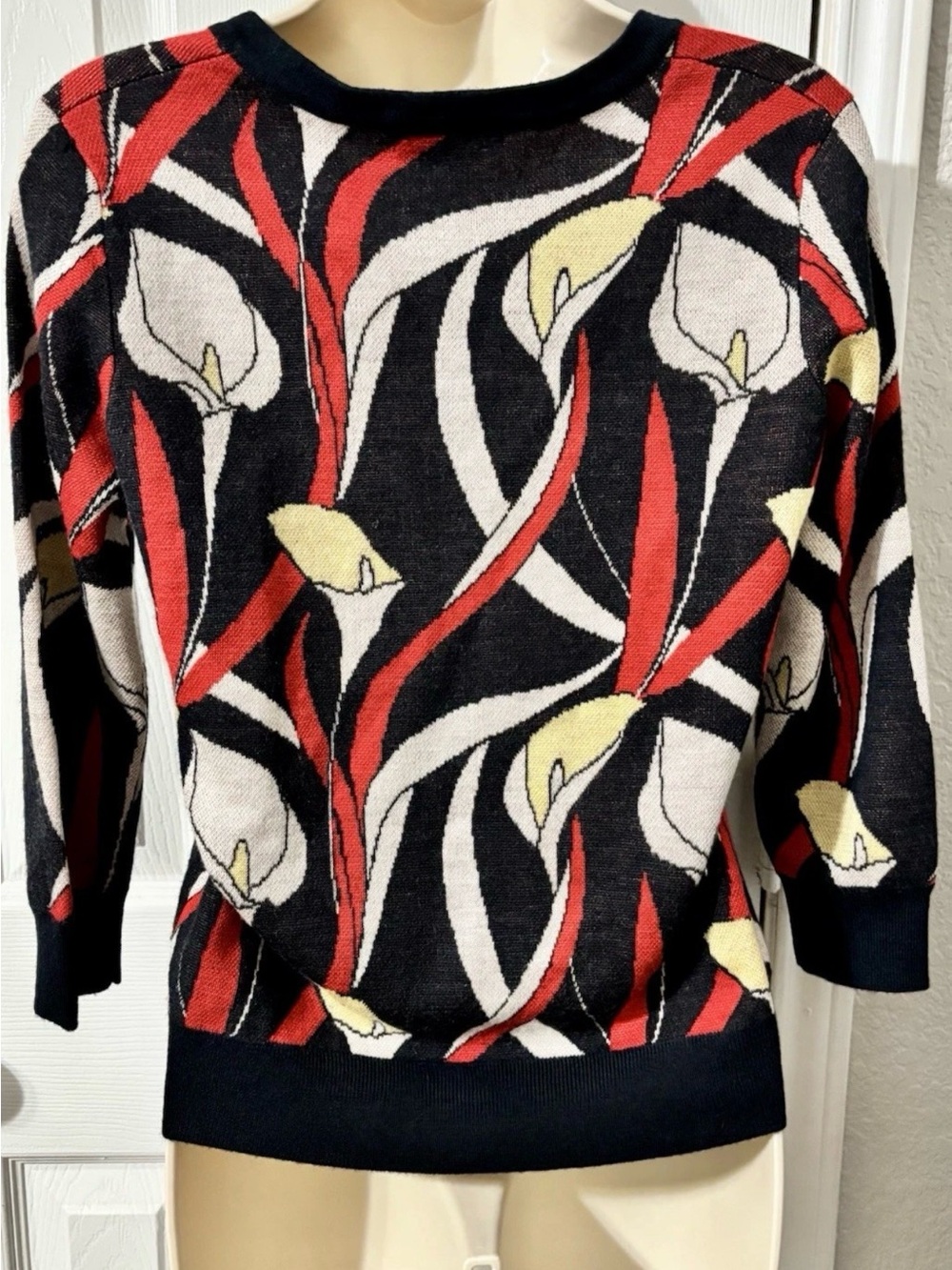 Chelsea & Theodore Black Pullover Sweater with Red and Yellow Floral Motif